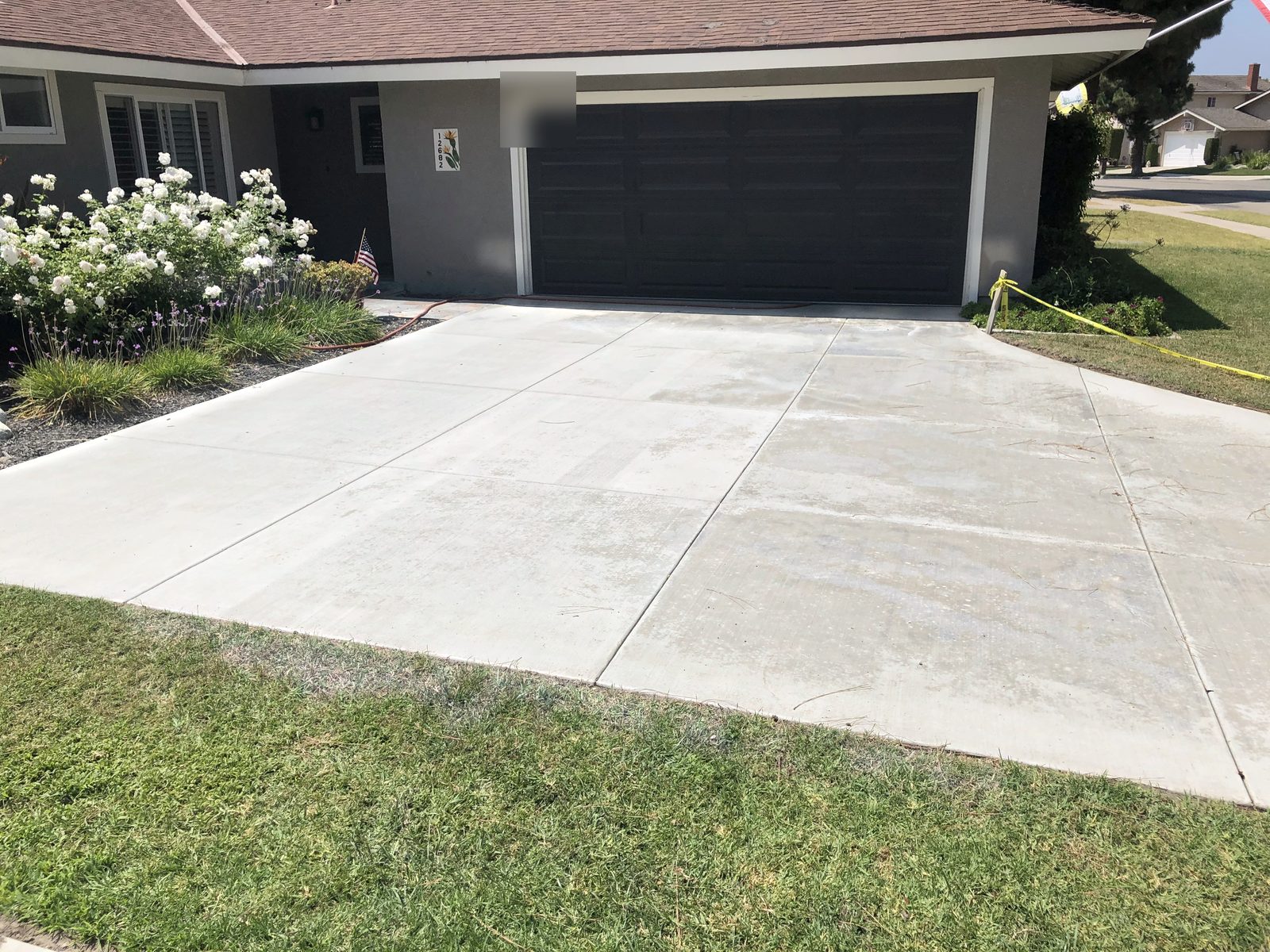 Concrete driveway by Driveway Masters, serving Stanton, CA