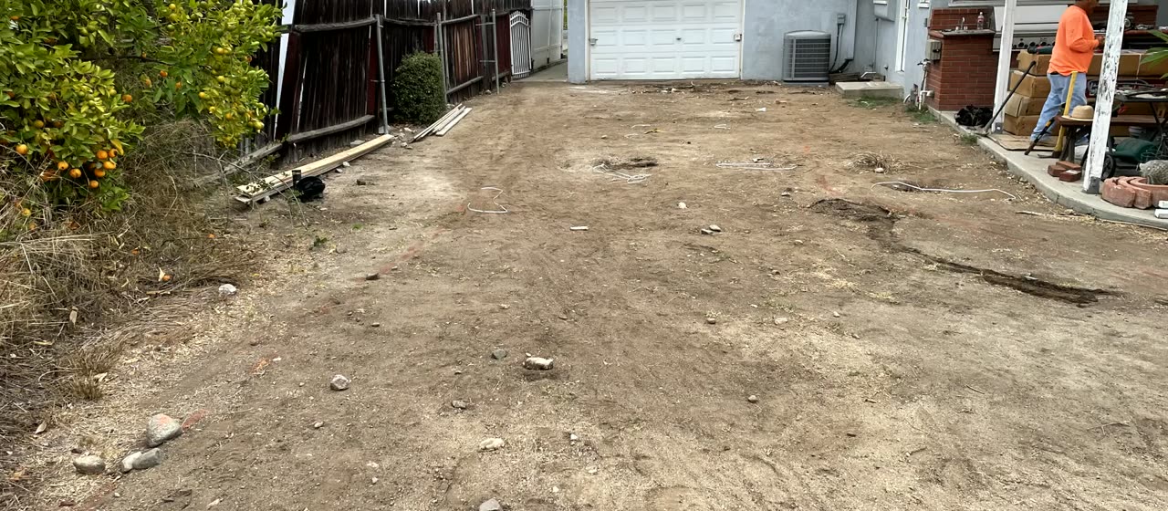 Bare dirt side yard before the new driveway in Glendora