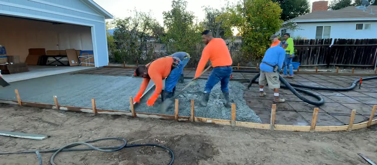 Crew placing concrete on pour day