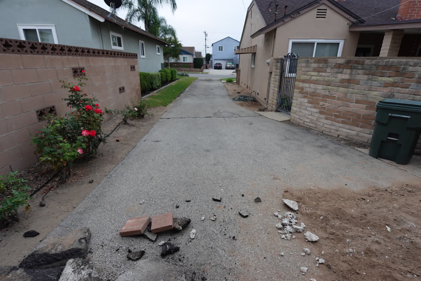 Asphalt removed along the side of the house
