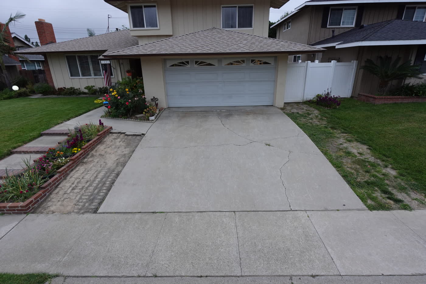 Old cracked concrete driveway before replacement in La Habra