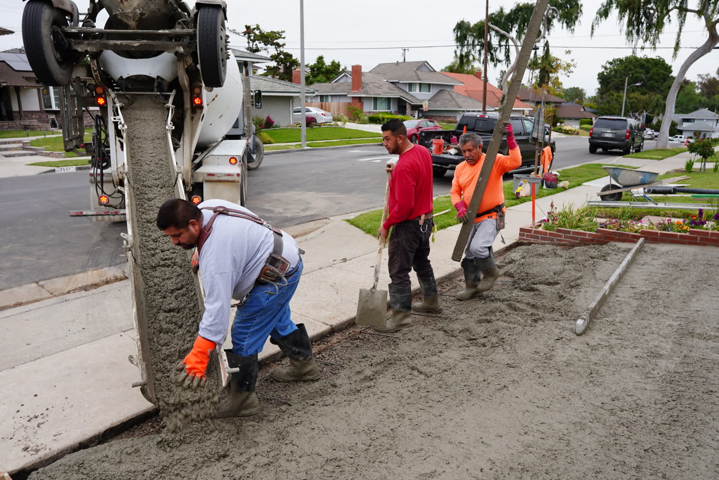 Crew pouring concrete straight from the ready-mix truck