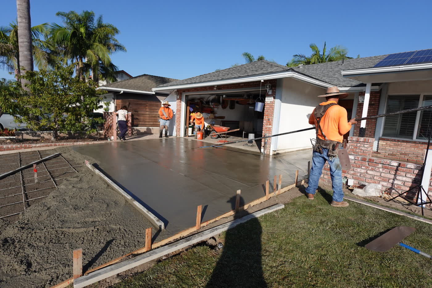 Crew placing concrete on pour day