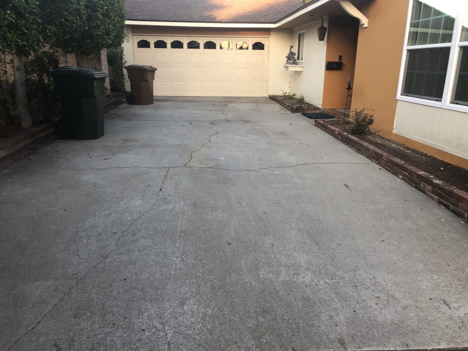 Old cracked concrete driveway in Fullerton before replacement