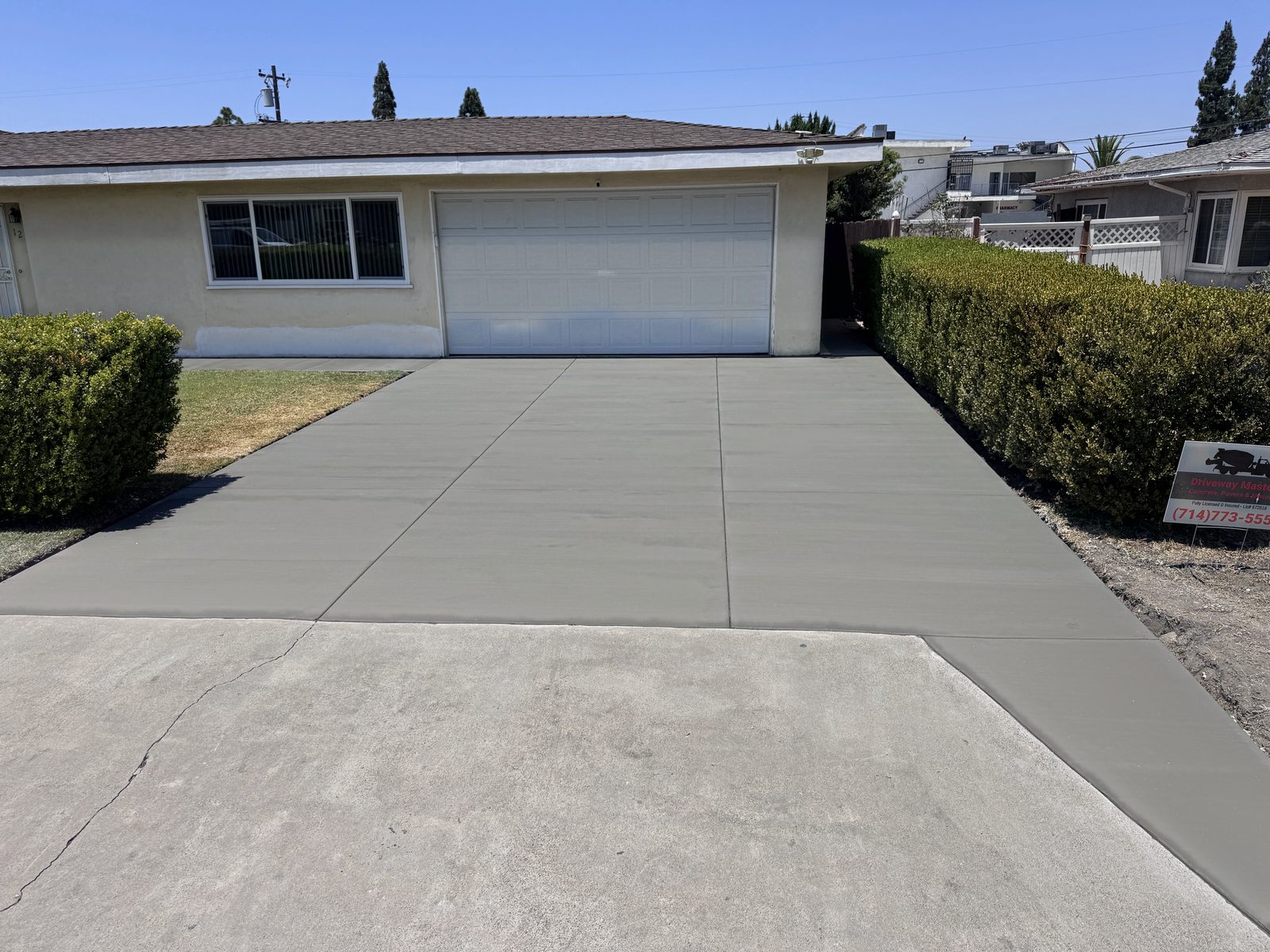 The same Garden Grove driveway with fresh broom-finish concrete