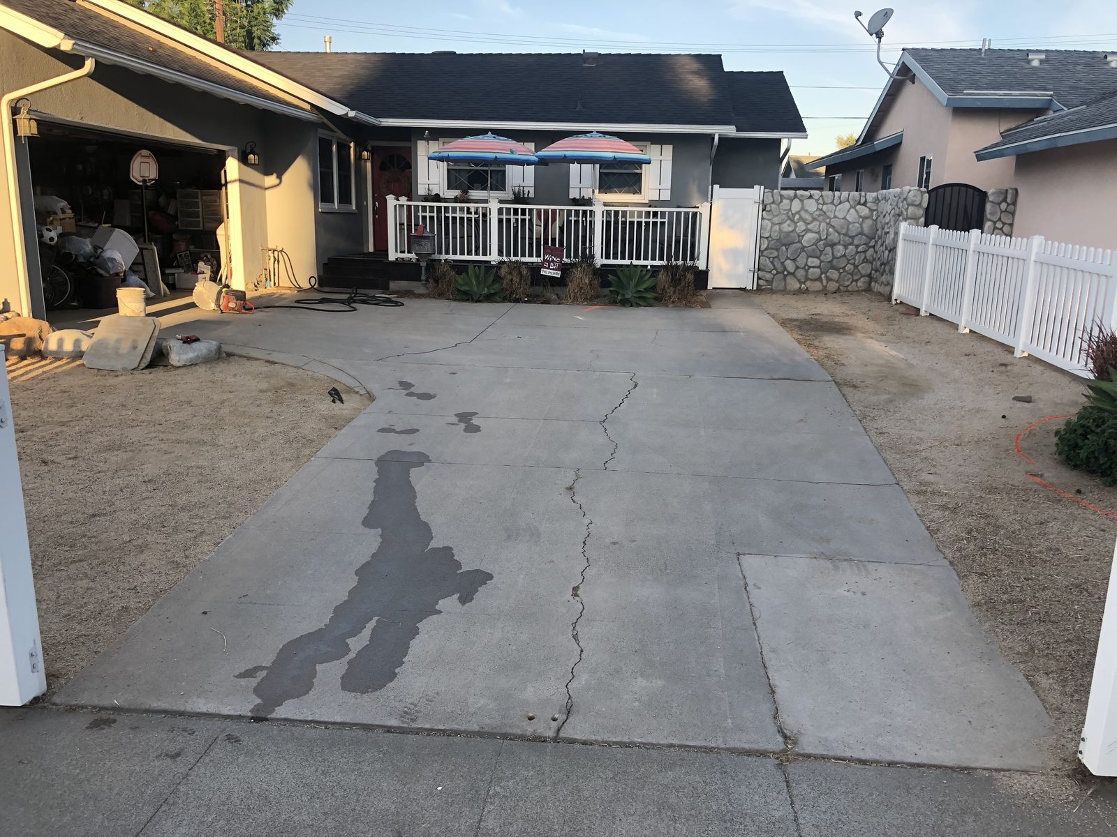 Stained and cracked driveway in Orange before replacement